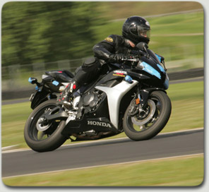 Michael A. Colbach is an Oregon motorcycle accident attorney and rides street, motocross and track bikes.  Pictured is Mike at a PIR track day riding a 600 CBR RR.