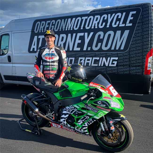 Portland, Oregon pro motorcycle racer Andy DiBrino pictured with his super bike 1000 and Oregon Motorcycle Accident Attorney branded van.