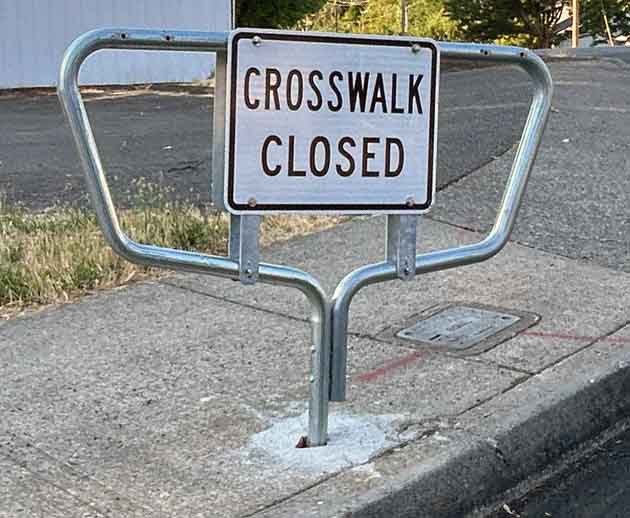 This sign is an example of what a Crosswalk Closed sign looks like in Portland, Oregon.