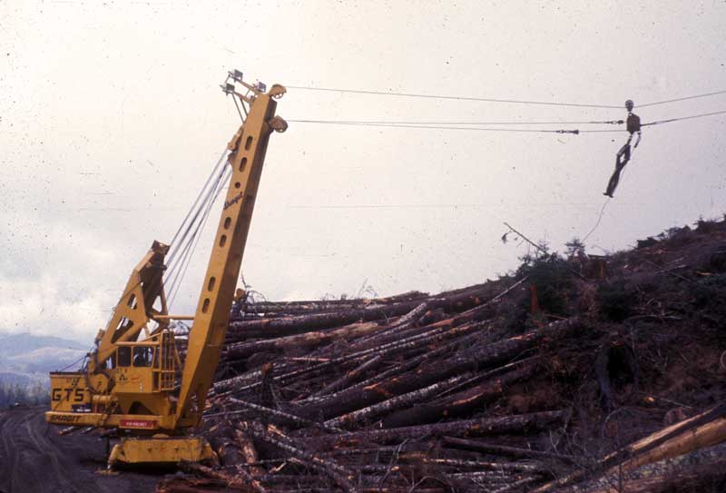 logging in Oregon machine worker yarding logs